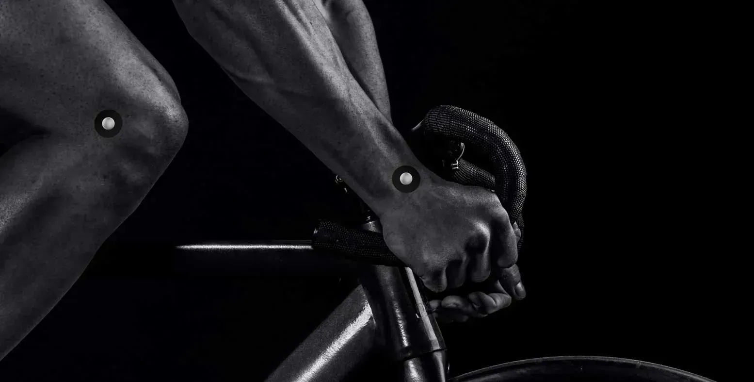 Close-up of cyclist with tracking markers on their hands.